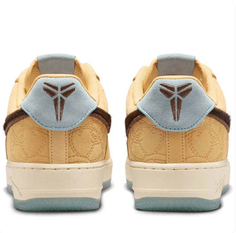 Nike Golden Tan Low-Top Sneakers with Dark Brown Swoosh and Pale Blue Accents