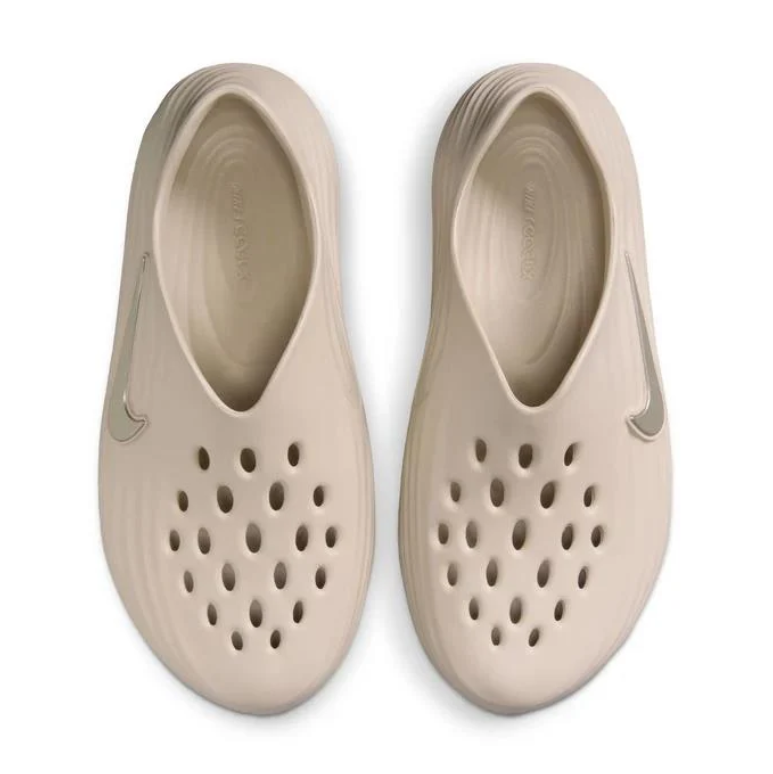 Nike Beige Slip-On Clogs with Vent Holes and Wave-Ridged Sides
