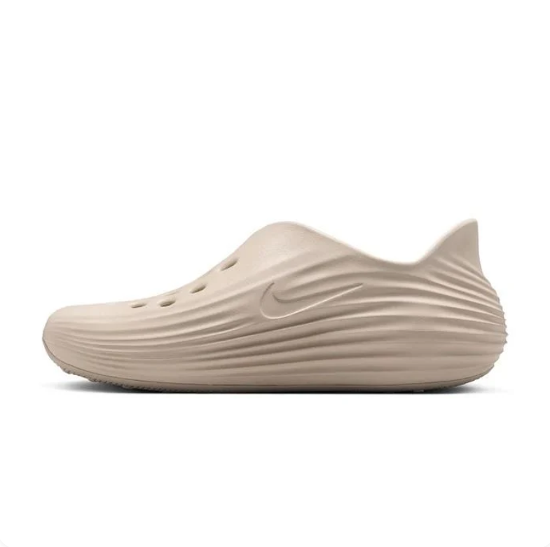 Nike Beige Slip-On Clogs with Vent Holes and Wave-Ridged Sides